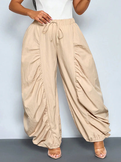 Women's Beige Loose Wide Leg Pleated Casual Pants With Drawstring Waist And Pockets by MadisonnSavannahBoutique