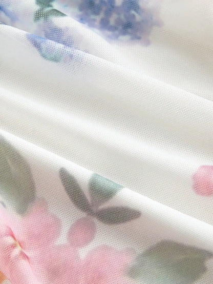 Elegant White Floral A-Line Maxi Dress With Spaghetti Straps And Waist Tie by MadisonnSavannahBoutique