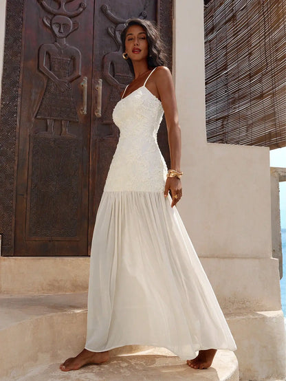 Elegant White Lace Maxi Dress With Spaghetti Straps Flared Hem by MadisonnSavannahBoutique